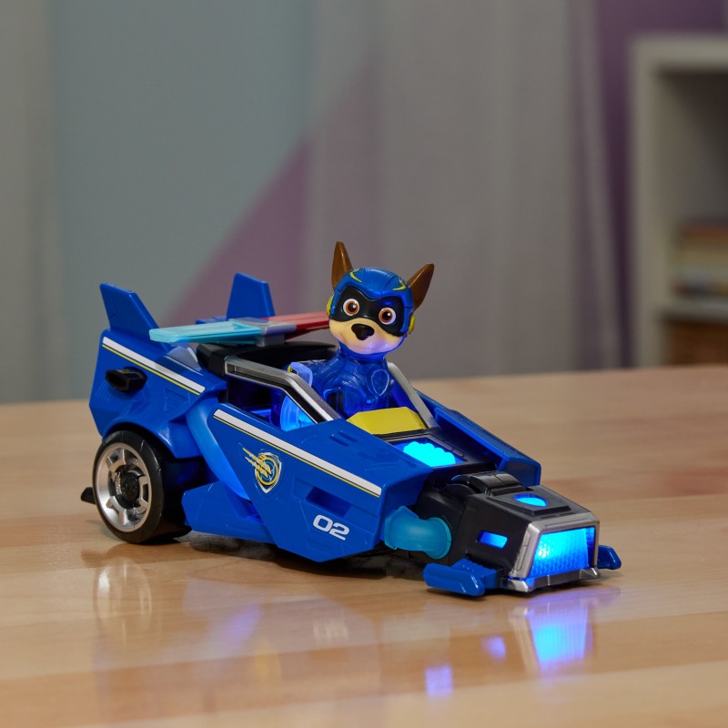 PAW Patrol La patrulla canina la Superpelícula, coche de juguete con figura de acción de Chase de Mighty Pups, luces y